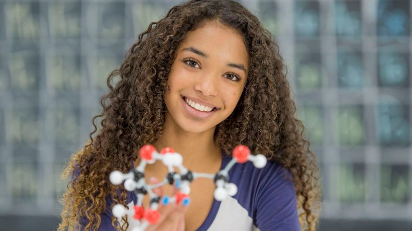Teenage girl with 3D molecula models