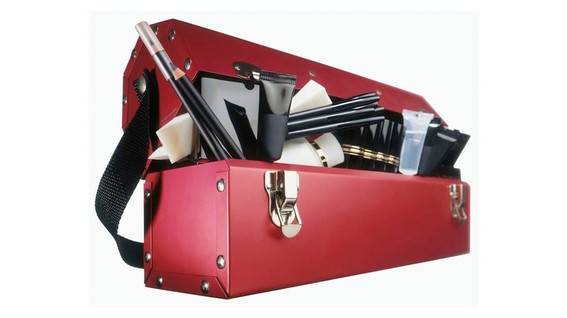Red professional toolbox style case full of makeup