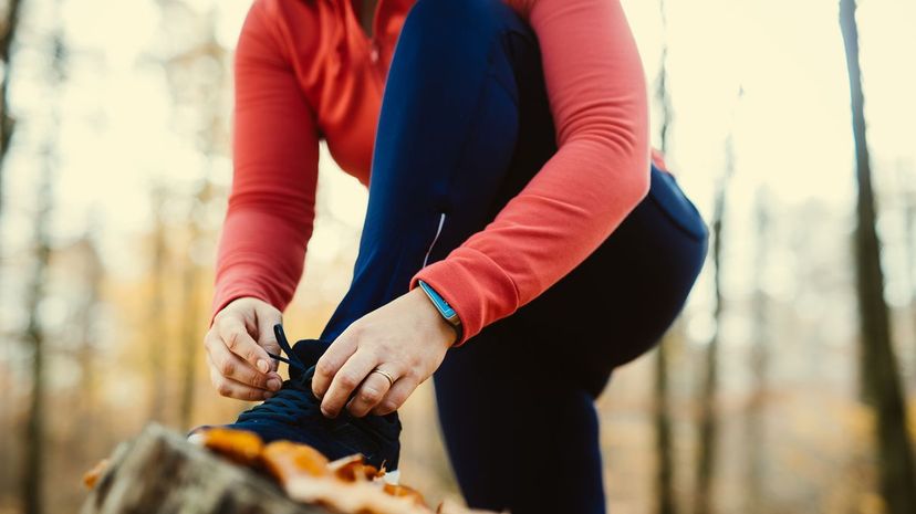 Woman Fixing Shoelaces