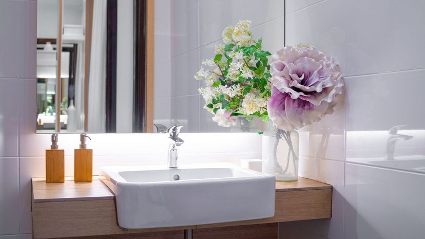 Bathroom sink with flower and soap dispenser