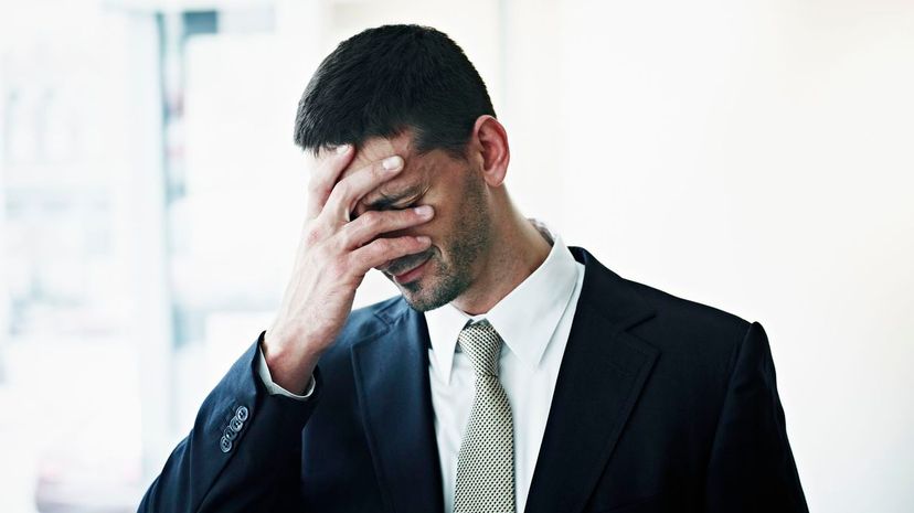 Man with head in hand