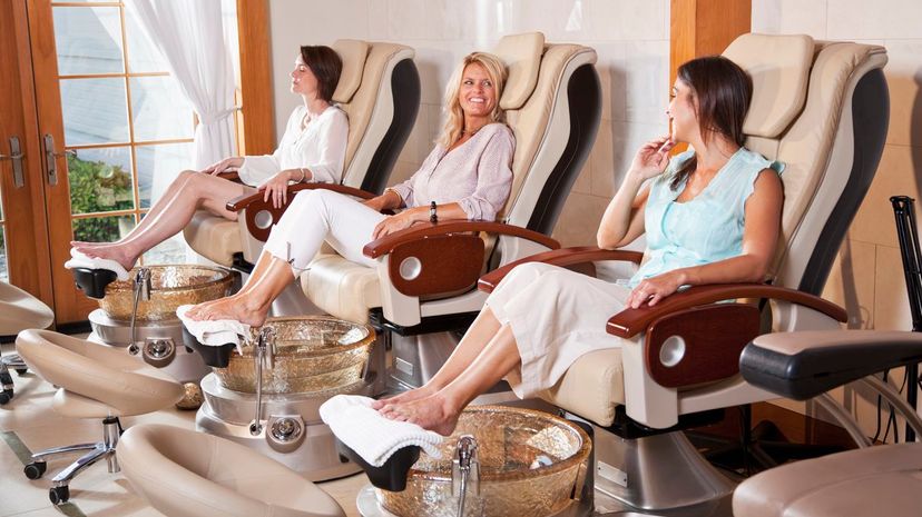 Women getting pedicures at spa