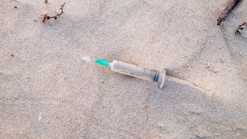 syringe on beach