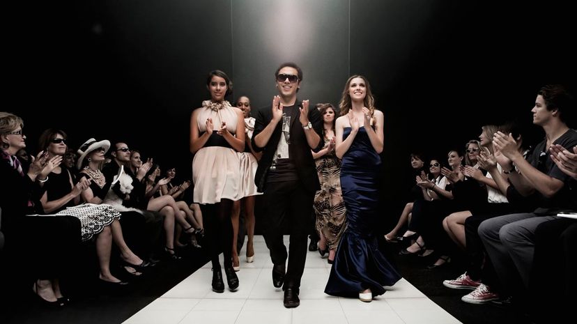 People clapping on runway in fashion show