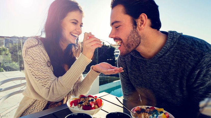 Couple eating breakfast outdoors