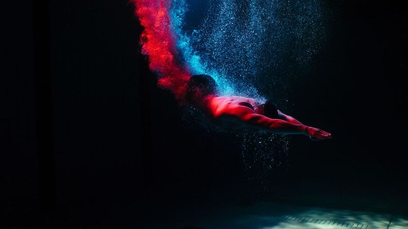 Man diving into pool colorful