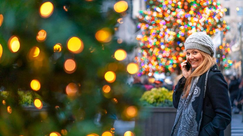 Woman making phone call Christmastime