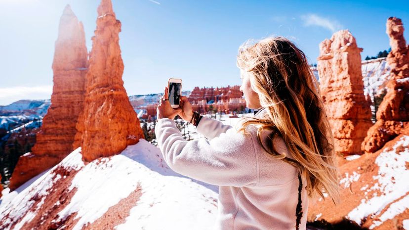 Woman taking photograph at Bryce Canyon National Park, Utah