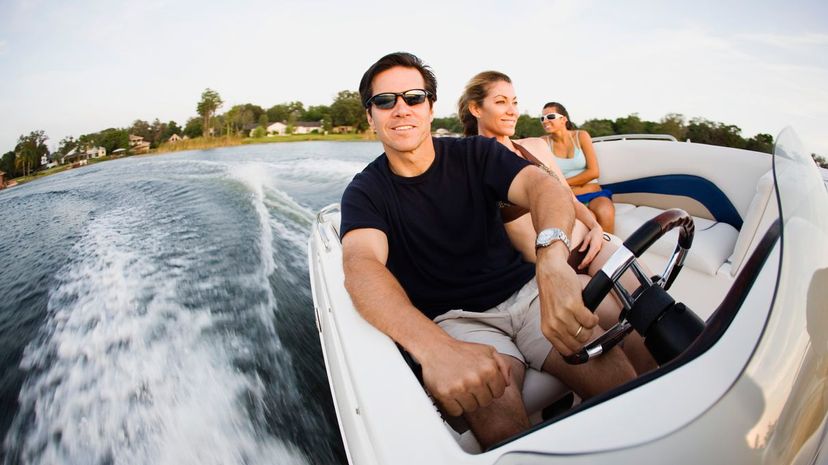 Friends riding speedboat