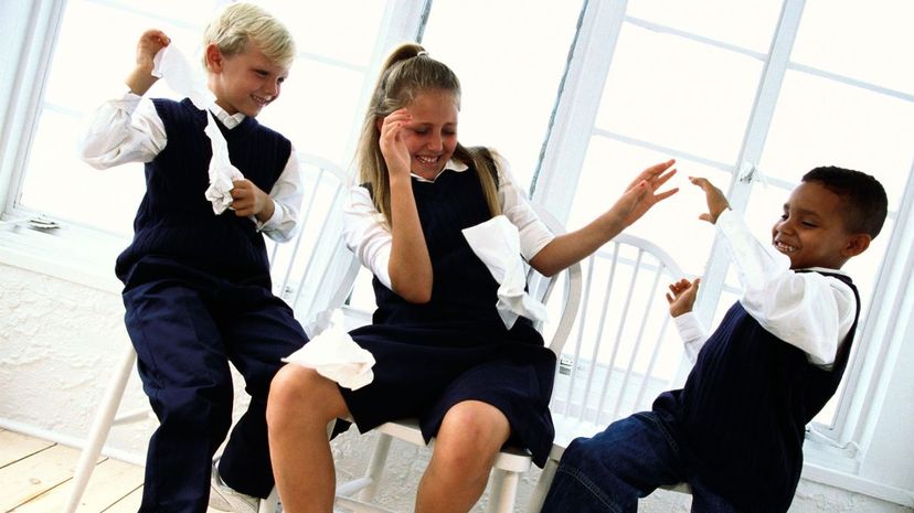 Children throwing tissue paper at each other