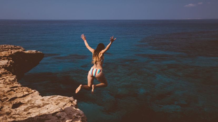 Woman cliff jumping