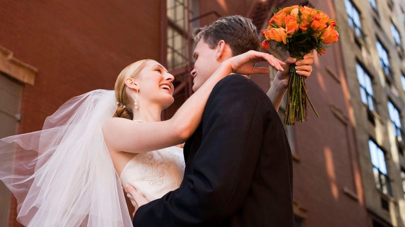 Bride and groom embracing on New York City street