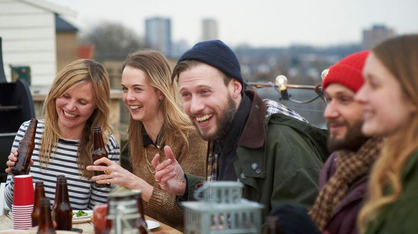 Friends laughing rooftop