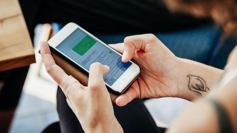 Woman Messaging Friends Using Smartphone