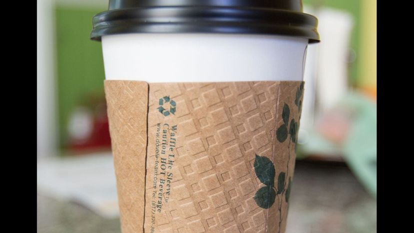 zarf (holder placed around a coffee cup; can be made of cardboard or ornamental metal)