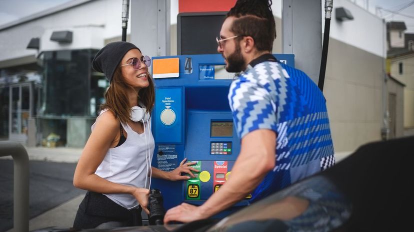 Man and woman at gas station