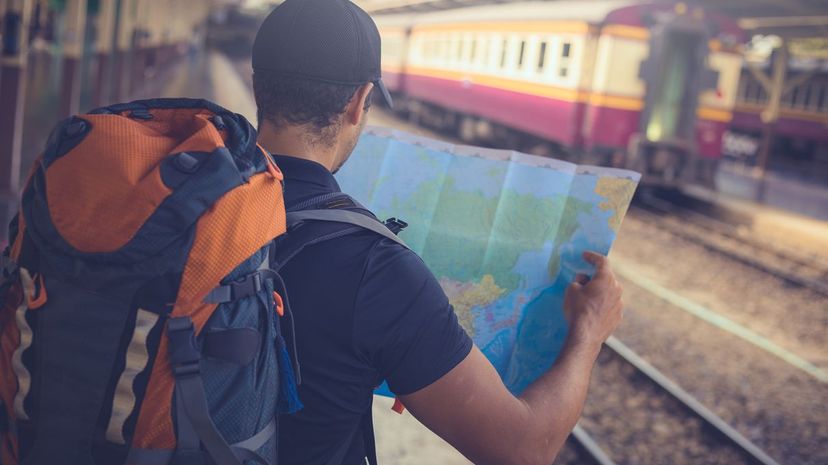 Backpacker Looking at Map