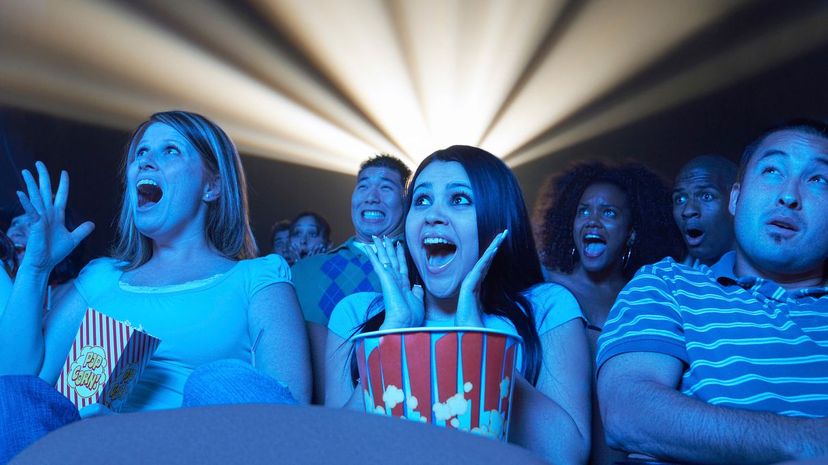 People excited at movie theater