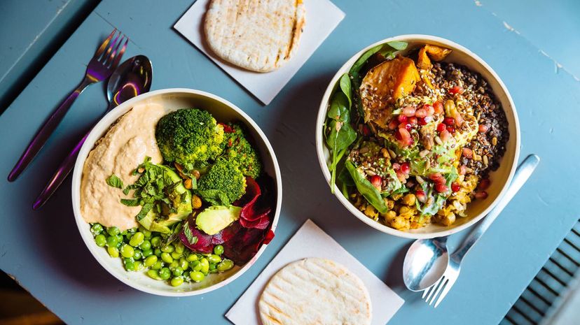 Vegan bowls with various vegetables and seeds