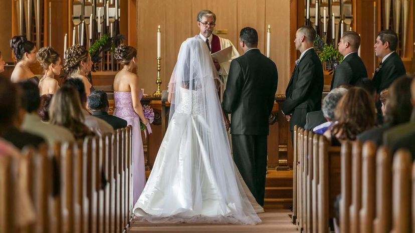 Bride and groom standing at altar during wedding ceremony