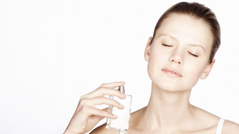 Girl spraying perfume