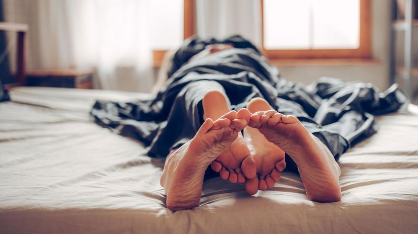 Couple Feet in Bed