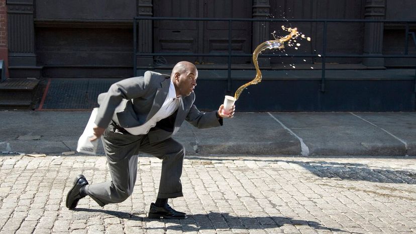 24 Clumsy man spilling coffee