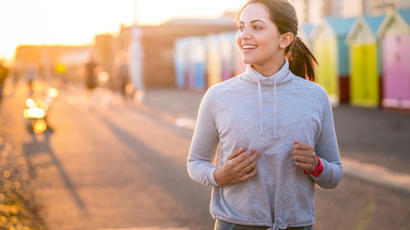 Woman Jogging by Beach