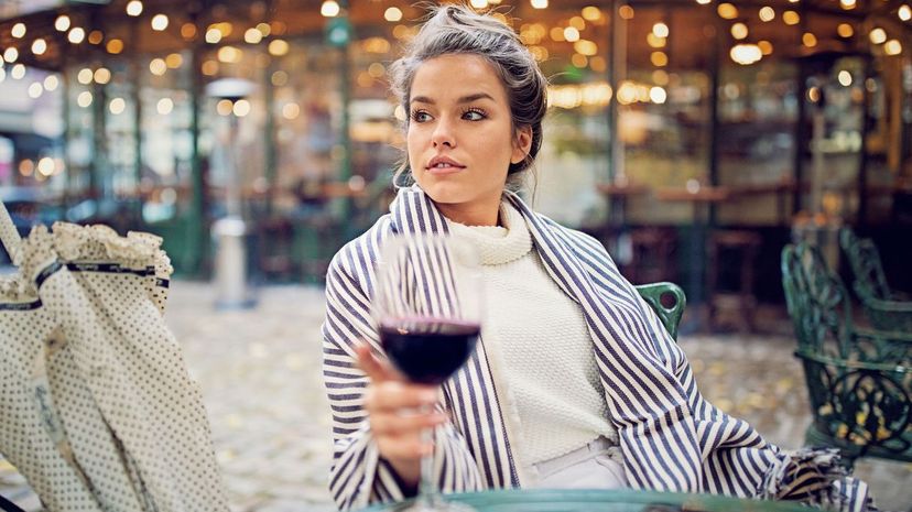 Young woman drinking wine