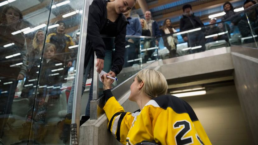 Female Ice Hockey Player signing Autograph