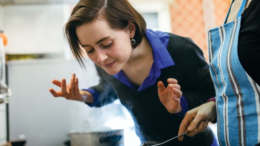 Woman smelling cooking