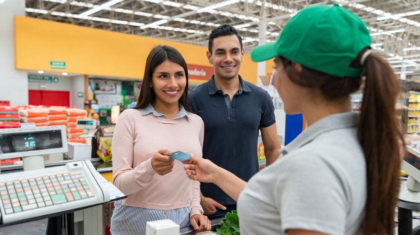 Couple paying for groceries