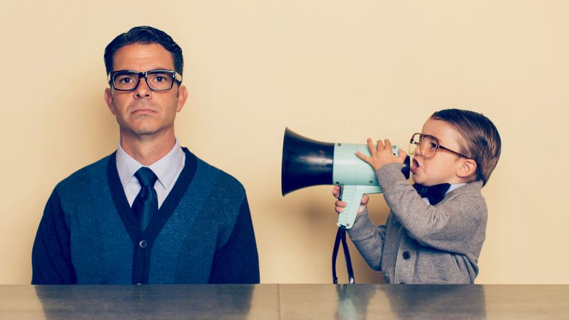 Boy with megaphone yelling at dad