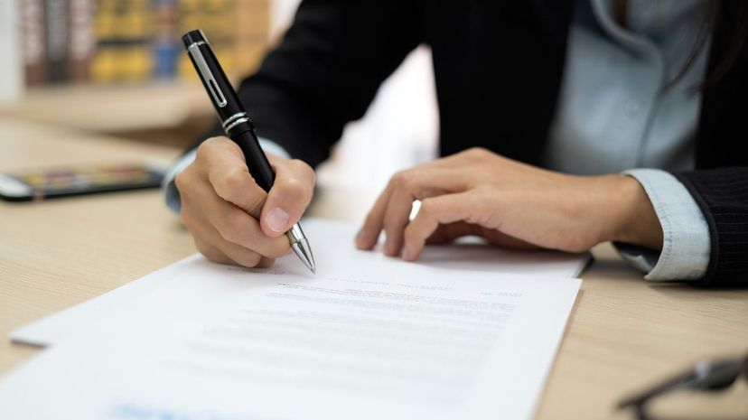 Woman signing job contract