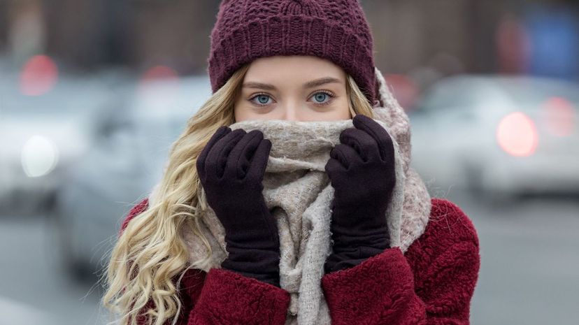 Young woman feeling cold in winter