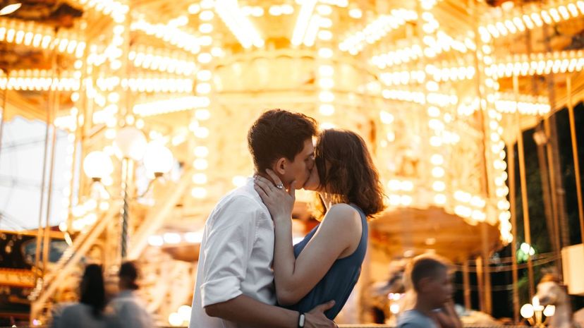 Kissing near carousel