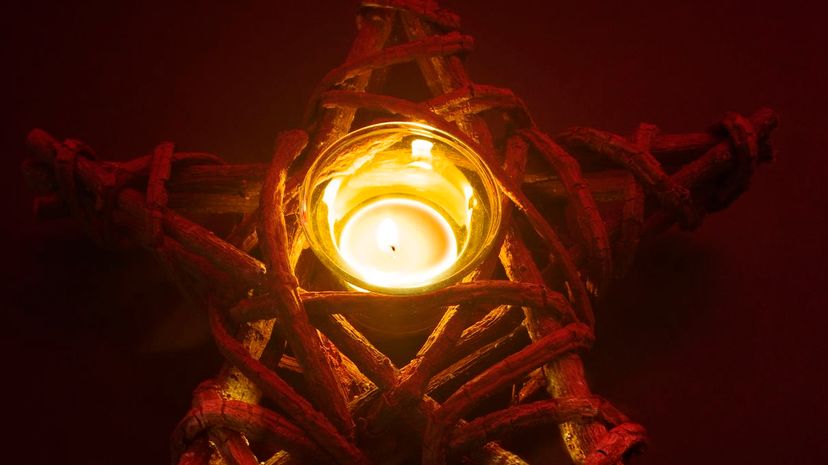 Pentagram Candleholder With Lighted Candle