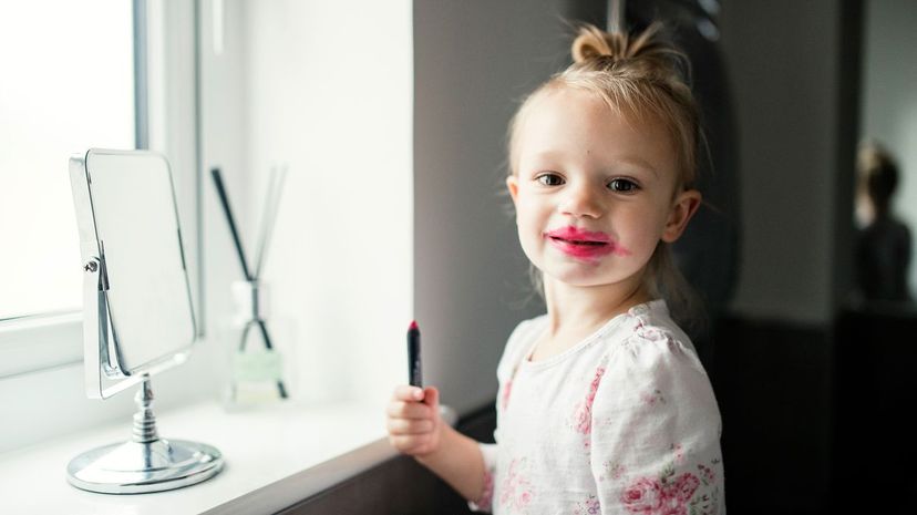 Child playing with lipstick