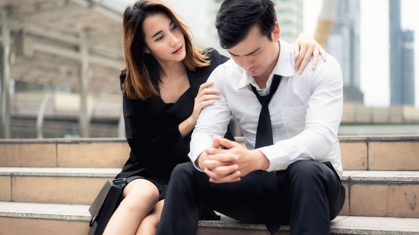 Woman comforting upset man