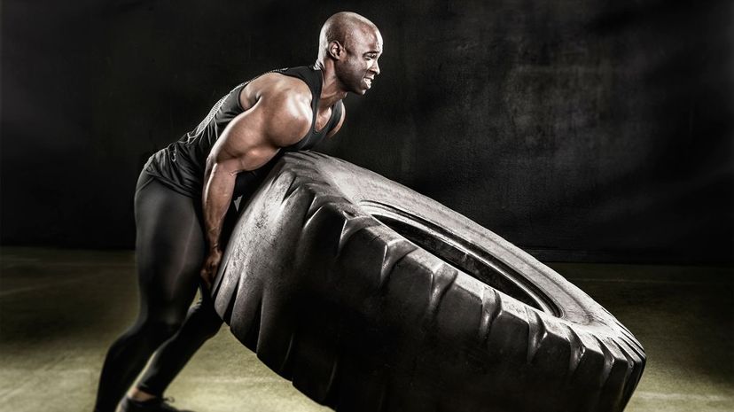 Man lifting tire