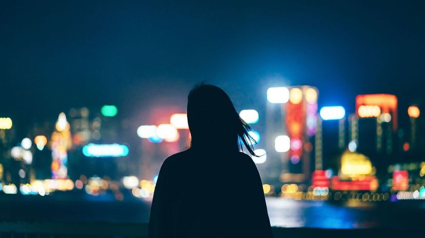 Woman staring at cityscape