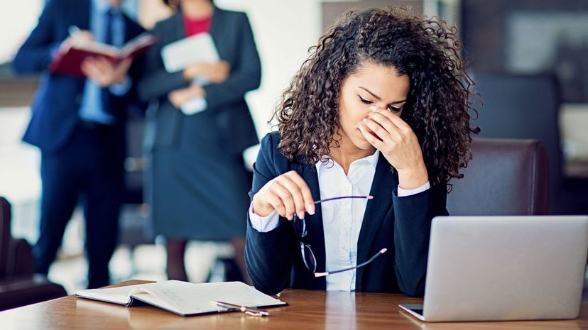 Burnout businesswoman under pressure in the office