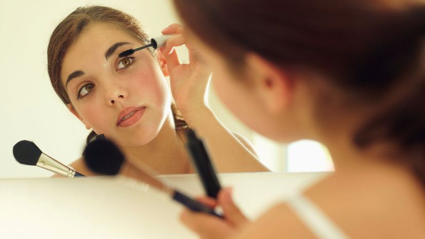 Girl putting on makeup