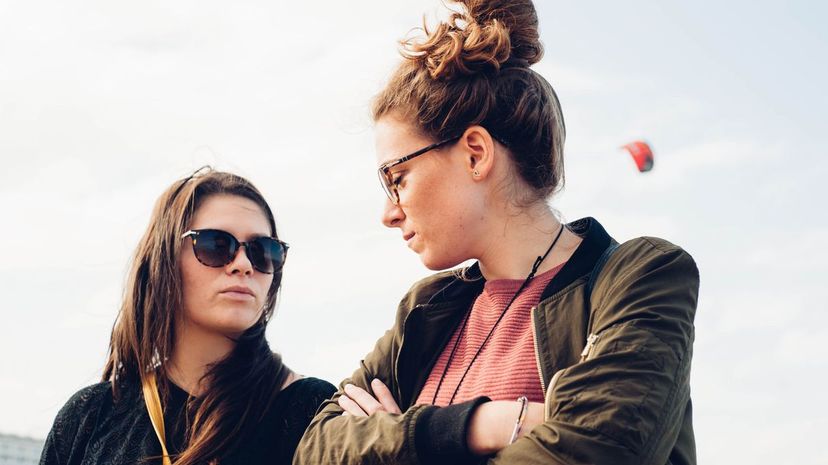 Two young women looking at each other