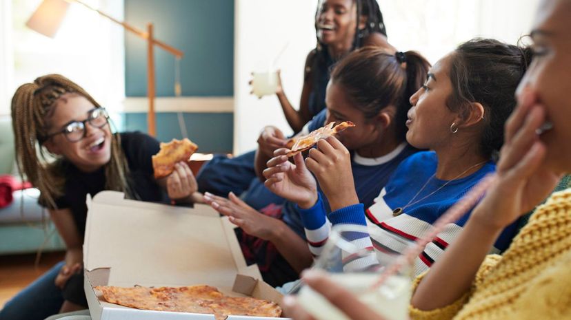 Women Eating Pizza Delivery