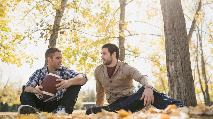 Friends having a conversation in the park