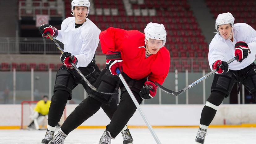 Tripping ice hockey player