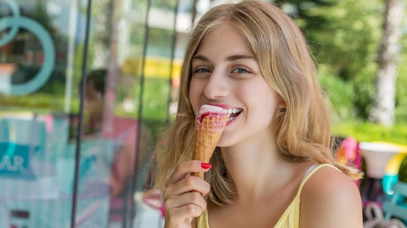 Young woman eating ice cream cone