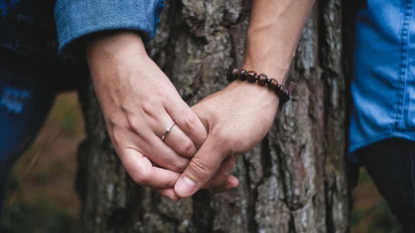 Couple hold hands