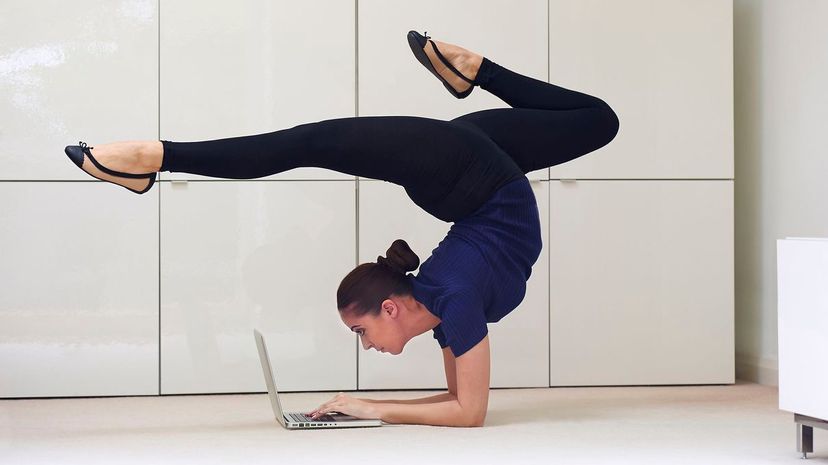 Contortionist using laptop computer